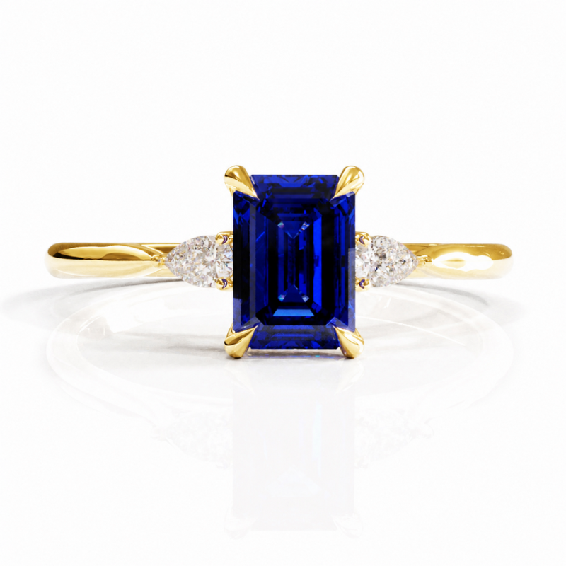 Emerald Cut Lab Grown Sapphire Three Stone Engagement Ring - Image 1